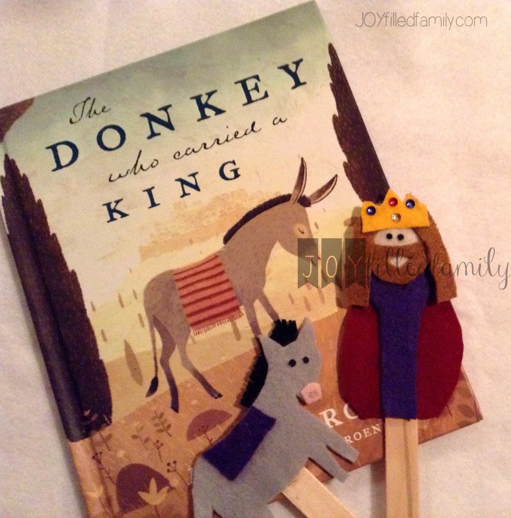 christ the king and donkey with book